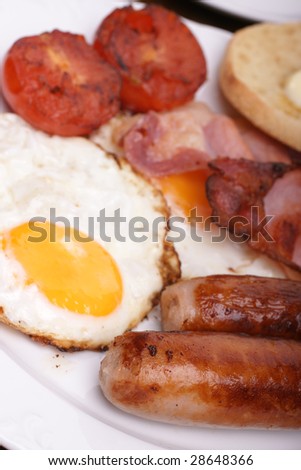 Freshly cooked breakfast with sausages and eggs