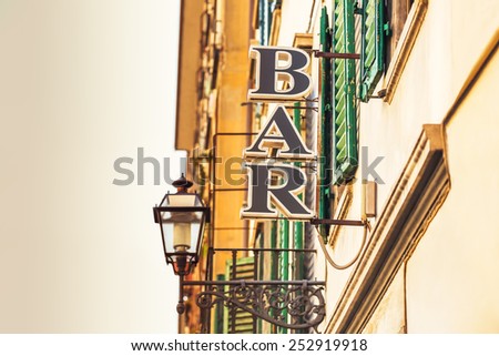 Vintage bar sign on a street of the city