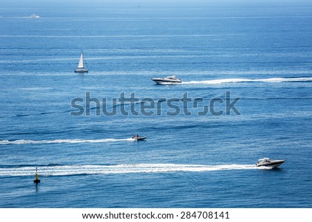 Group sailing of luxury yachts in Mediterranean Sea near French Riviera, Monaco