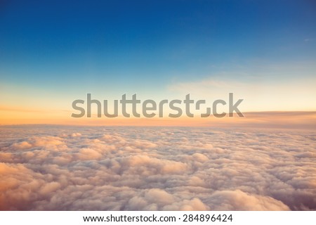 Flying above the clouds. view from the airplane, soft focus