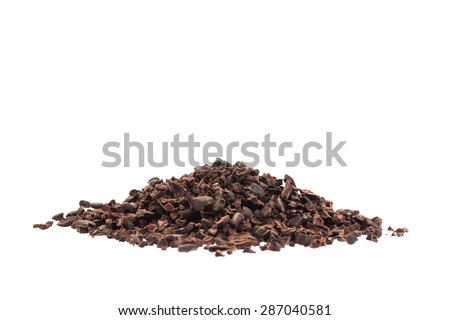 Raw organic cacao nibs on a white background