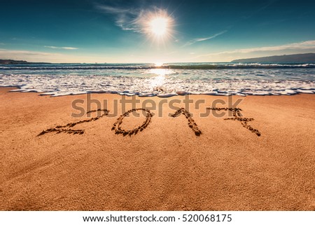 Happy New Year 2017 concept, lettering on the beach