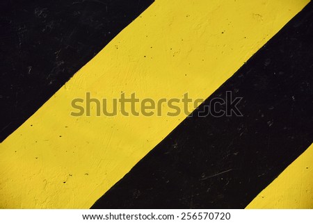 Yellow and black line painted on traffic sign