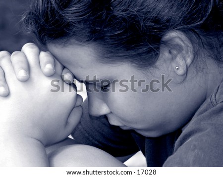 close up black and white of a young teen girl in prayer