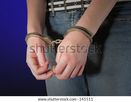 stock photo young woman in handcuffs Save to a lightbox Please Login