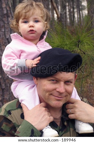 american army soldier with baby on his shoulders