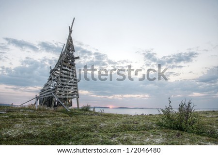 HDR image of abandoned and ruined navigation beacon on White sea shore, Russia