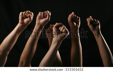 People putting their fists in the air