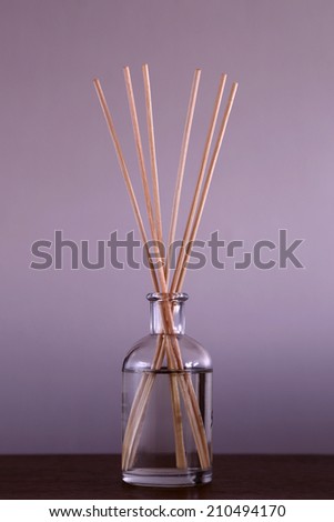 Scented oil bottle with sticks to help the home smell good.