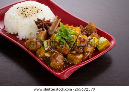 Japan cuisine. rice with porc meat zucchini in honey sauce.