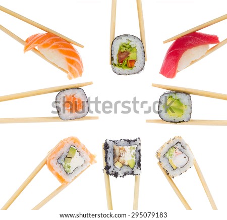 Different sushi and rolls in chopsticks isolated on whit background