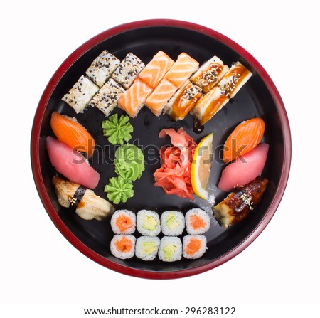 Asian food sushi set on wooden plate isolated on white background
