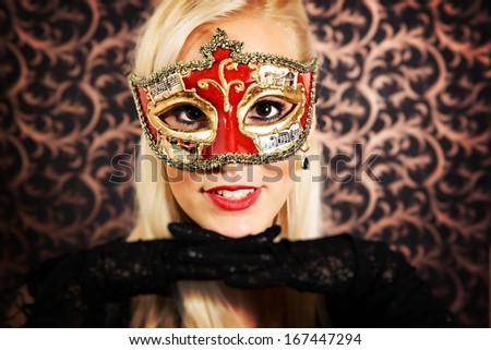 Elegantly dressed light hair model wearing a mask.