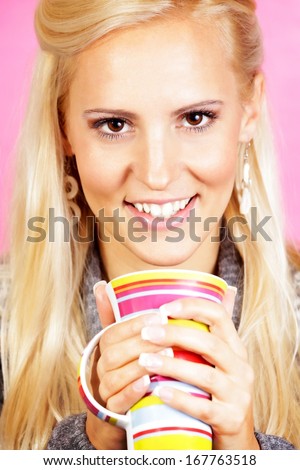 Light hair female model, drinking tea.