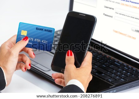 Female hand,using internet card for e-banking.