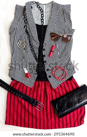 Punk / rock fashion outfit. Black, white and red combination.Top view.