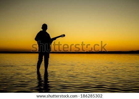 silhouette of man\'s salt lake (salt lake - turkey)