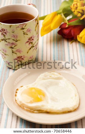 tea, fried egg and tulips