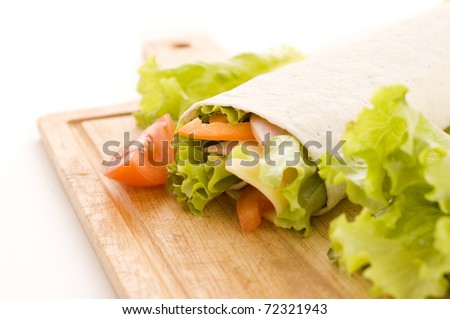 roll sandwich with ham, cheese and vegetables