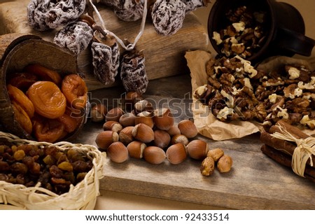 dried fruits and nuts on wooden background
