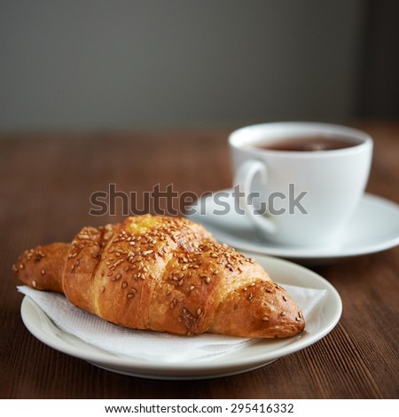 croissant with sesame  on wooden background