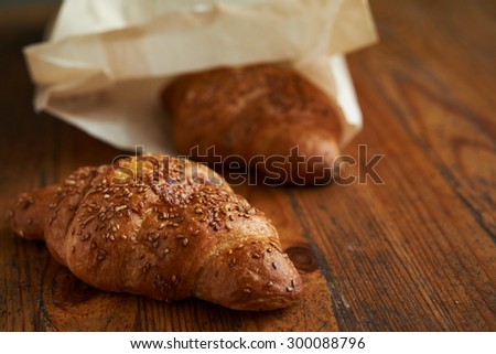 croissant with sesame  on wooden background