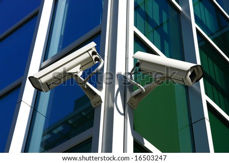 security cam on glass facade