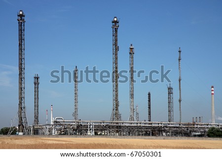 pipes and chimney in oil refinery and agriculture field