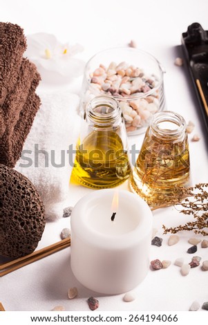 SPA still life: massage oil, towels,pebbles and herbs
