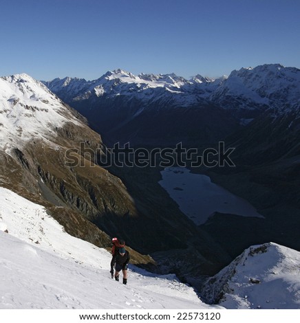 Mountaineer on a 3 day alpine crossing of the Ball Pass in Aoraki Mt. Cook National Park, New Zealand