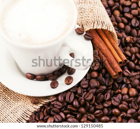 The coffee beans, a cup of coffee.