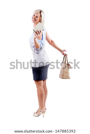 An attractive successful woman buys a hand bag and wallet.