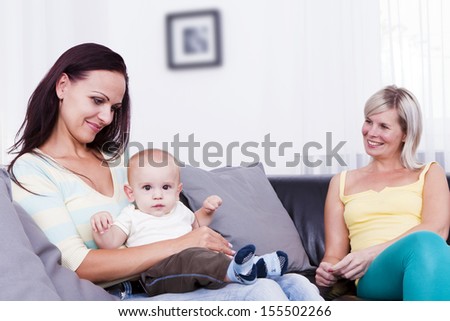 Family in living room with baby boy.