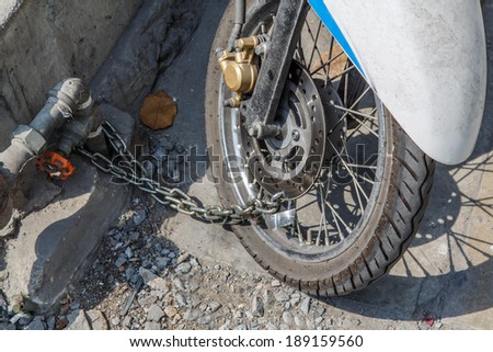 Security lock blocking the motorcycle wheel