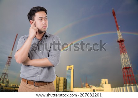 Businessman thinking face expression. Male emotional expression on Antenna broadcast TV background. Concept photo of thoughts, worries, problems
