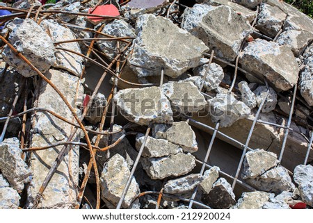 Destroyed building and pile of debris brick and cement
