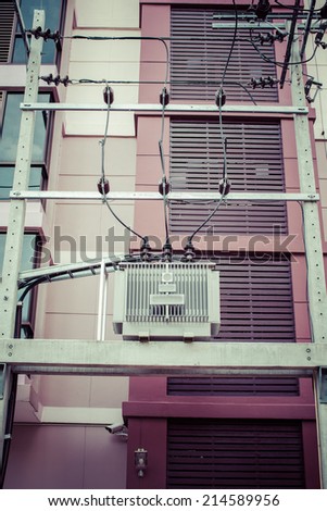 Electricity distribution transformer with Building, process color
