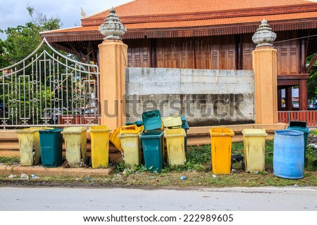 Yellow, green,blue sky bins , Recycling bins , Public trash on sidewalk