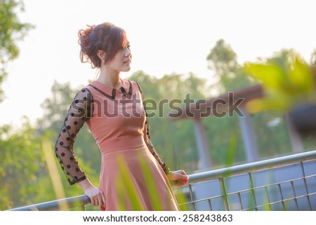 Asian woman smiling happy on sunny summer in park
