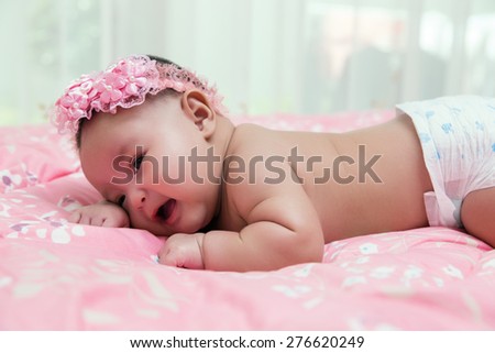 Newborn Asian baby . 55 days after birth, process color