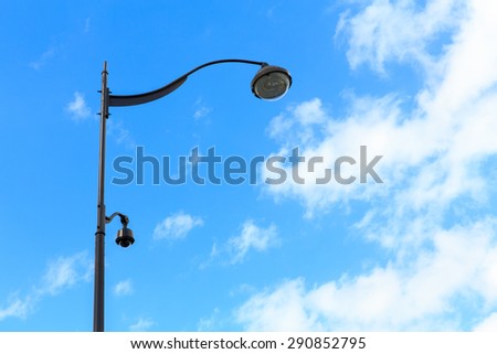 CCTV cameras and led lantern on sky background in paris, france
