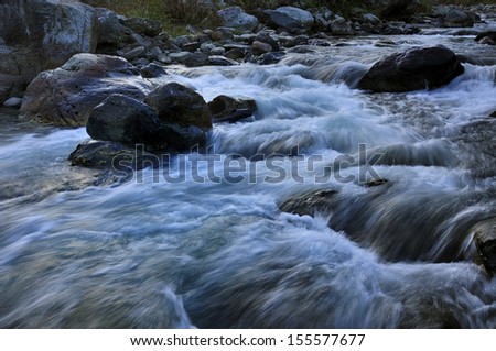 River water flowing through rocks at dusk, Reshi River, Reshikhola, Sikkim