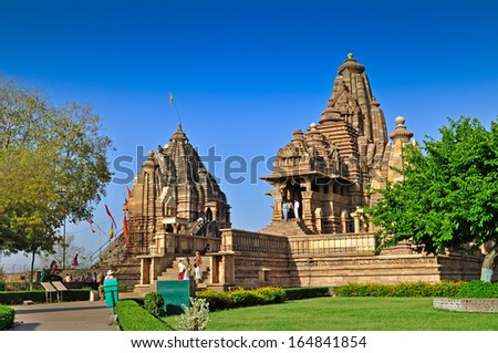 Khajuraho, Madhya Pradesh , India - March 2011 :  Foreign visitors at Matangeshvara and Lakshmana Temple, Western Temples of Khajuraho on 21st March, 2011. It is a popular UNESCO world heritage site.