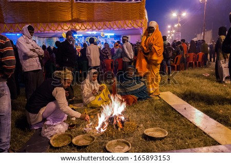 BABUGHAT, KOLKATA, WEST BENGAL / INDIA - 9TH JANUARY 2013 : Hindu devotees lighting a camp fire on 9th January, 2013 in Babughat transit Camp, Kolkata. They are on their way to Gangasagar (Sagar) .