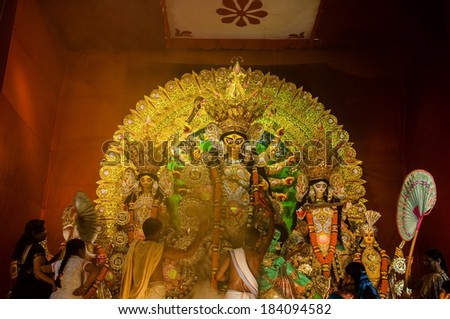 KOLKATA , INDIA - OCTOBER 11, 2013 : Durga Puja festival celebration. It is the biggest religious festival of Hinduism and local Bengali community