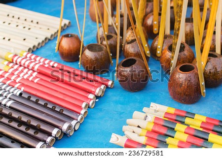 KOLKATA, WEST BENGAL , INDIA - NOVEMBER 23RD 2014 :  Flutes and monochords, artworks of handicraft, on display during Handicraft Fair in Kolkata - the biggest handicrafts fair in Asia.