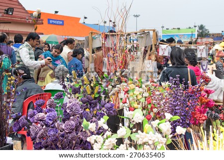 KOLKATA, WEST BENGAL , INDIA - DECEMBER 12TH 2014 : spongewood made artificial colored flowers, handicrafts on display in Handicraft Fair in Kolkata - the biggest handicrafts fair in Asia.