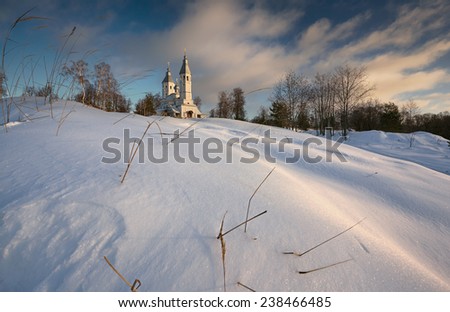 Church on the hill in the snow .The wind and the sky.\
Russia.Vladimir region.December.Church Of The Savior Transfiguration