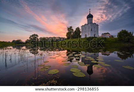 Church in the morning on the lake with beautiful clouds
