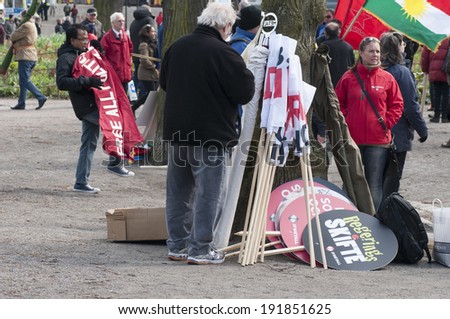 STOCKHOLM, SWEDEN - MAY 1: Parade participants are waiting for the event to start to celebrate the International Workers Day on May 1, 2014 in Humlegarden, Stockholm, Sweden.